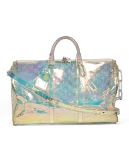 PVC Blue Monogram Keepall Bandoulière 50 - image 1 - front side of bag showing shoulder/crossbody strap, coated chain and luggage label