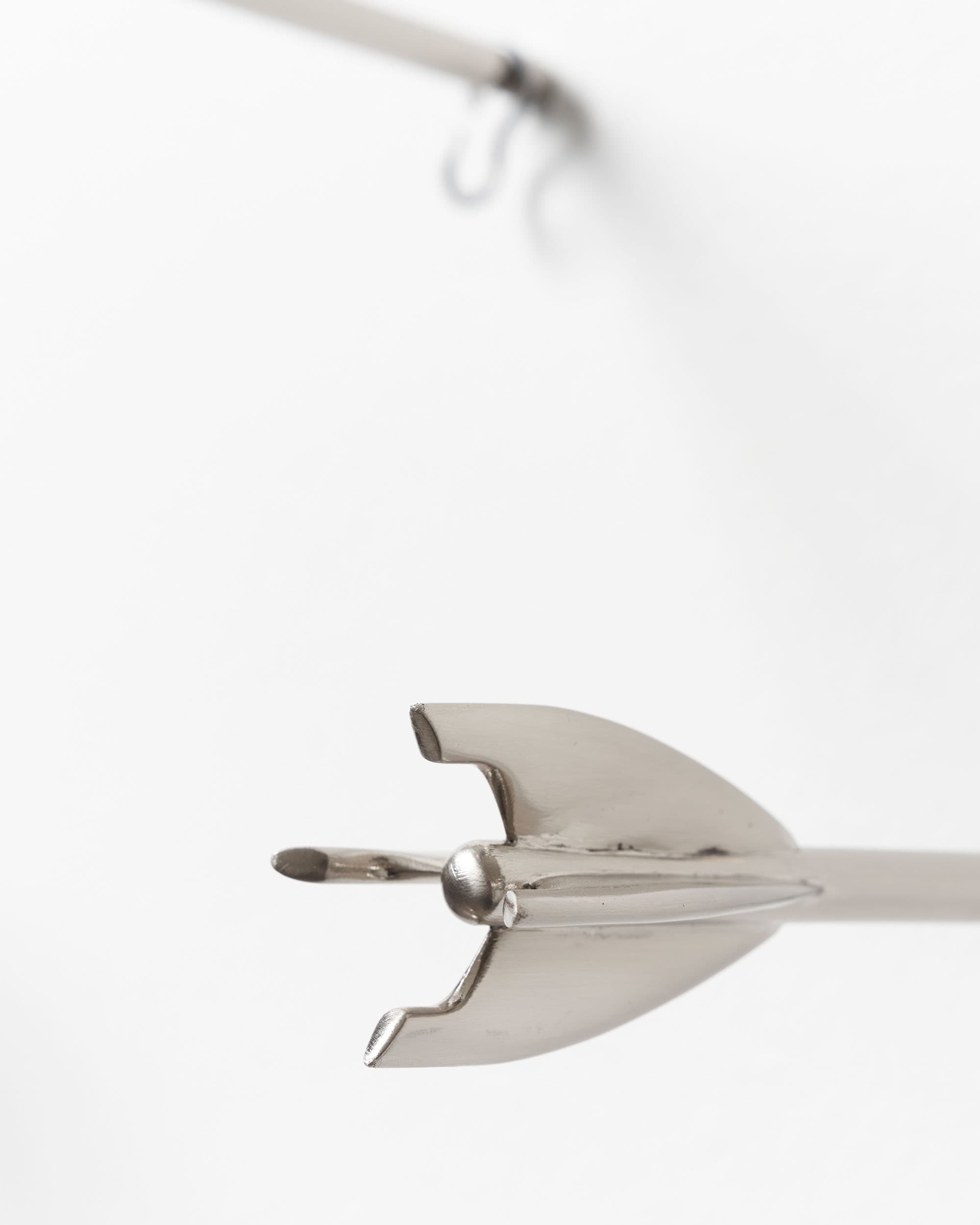 Five Brass Arrow Wall Hooks - image 5 - close-up image of the tail of one of the hooks