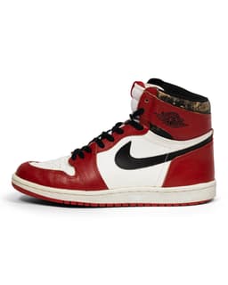Air Jordan 1 Retro High OG Chicago Sneaker - image 1 - side view of shoe - Nike Swish and Air Jordan logo
