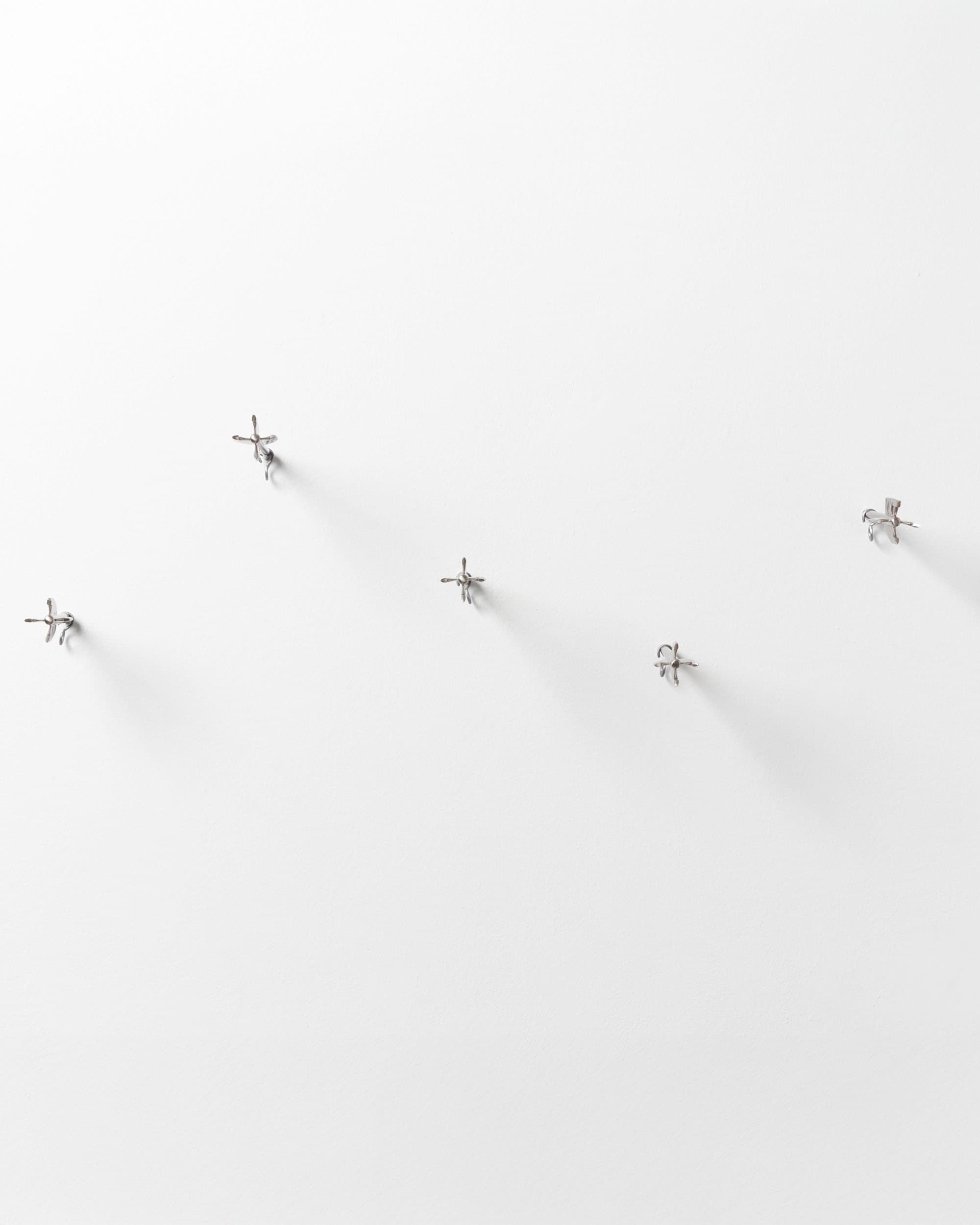 Five Brass Arrow Wall Hooks - image 11 - hooks embedded into wall