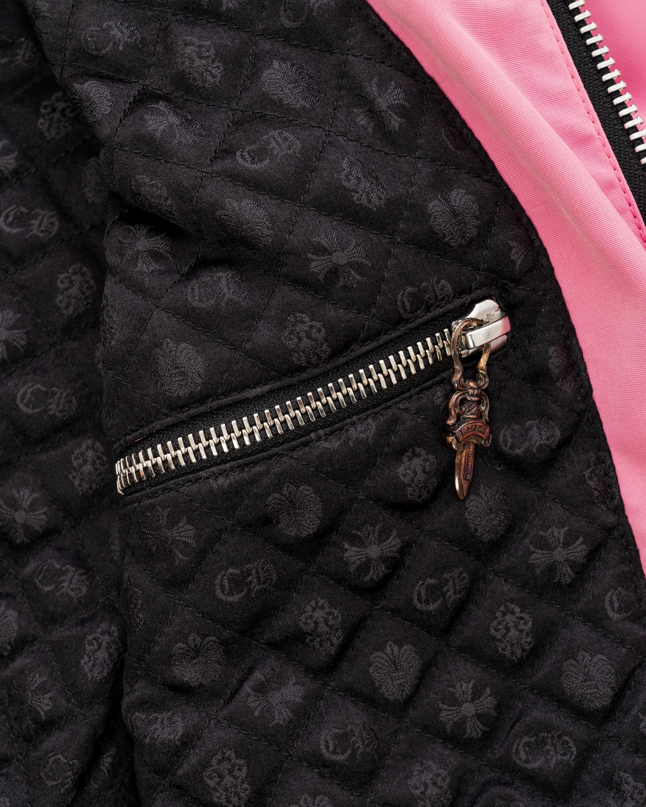 Pink Leather Bomber Jacket - image 4 - close-up of jacket lining with zipped pocket