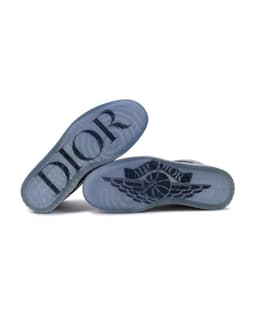 Dior x Air Jordan 1 High Sneakers - image 8 - bottom of sneakers, DIOR on left shoe outsole, AIR DIOR on right shoe outsole.