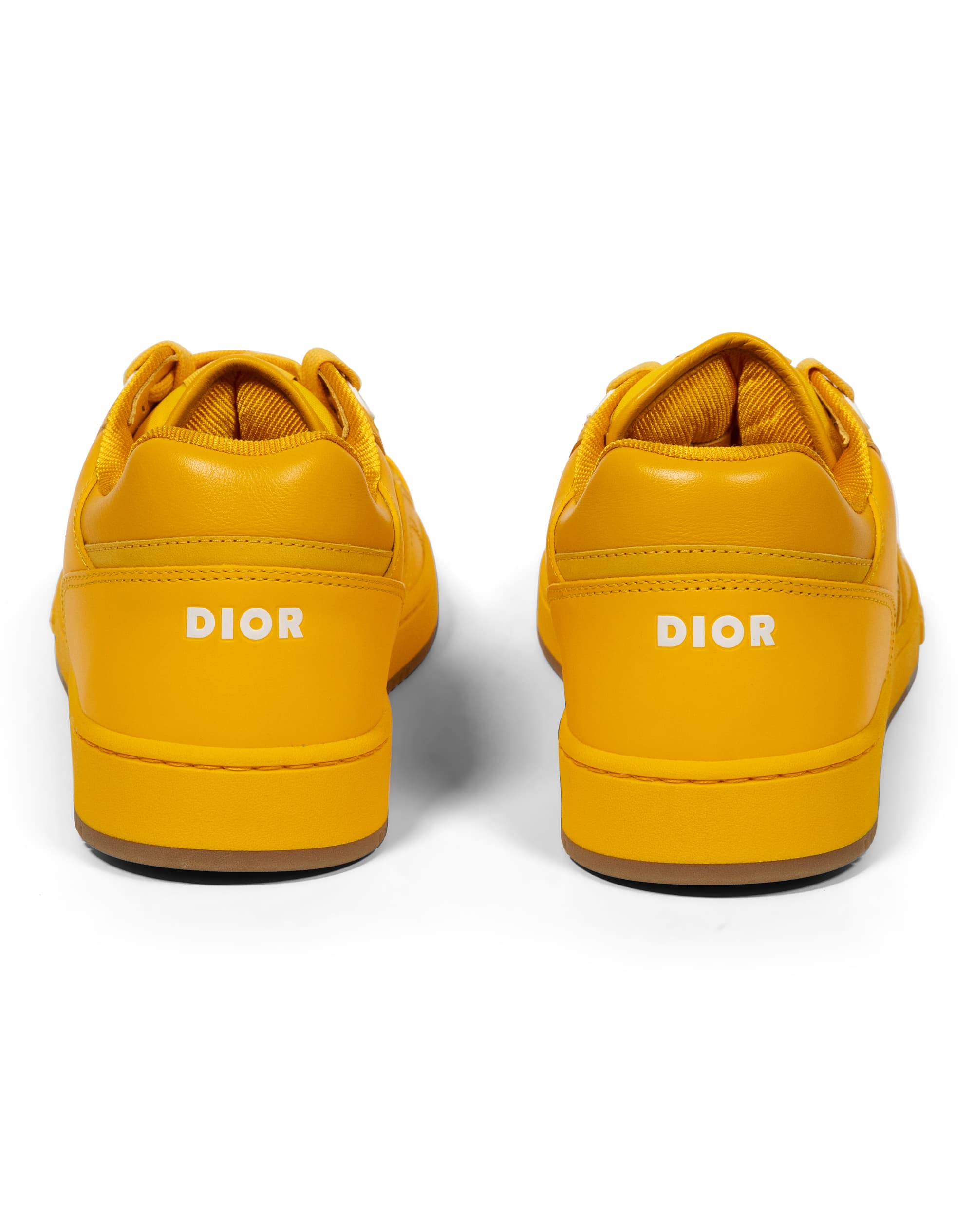 B27 Low Oblique World Tour Yellow Sneakers - image 6 - back of sneakers with DIOR logo on the back exterior foxing