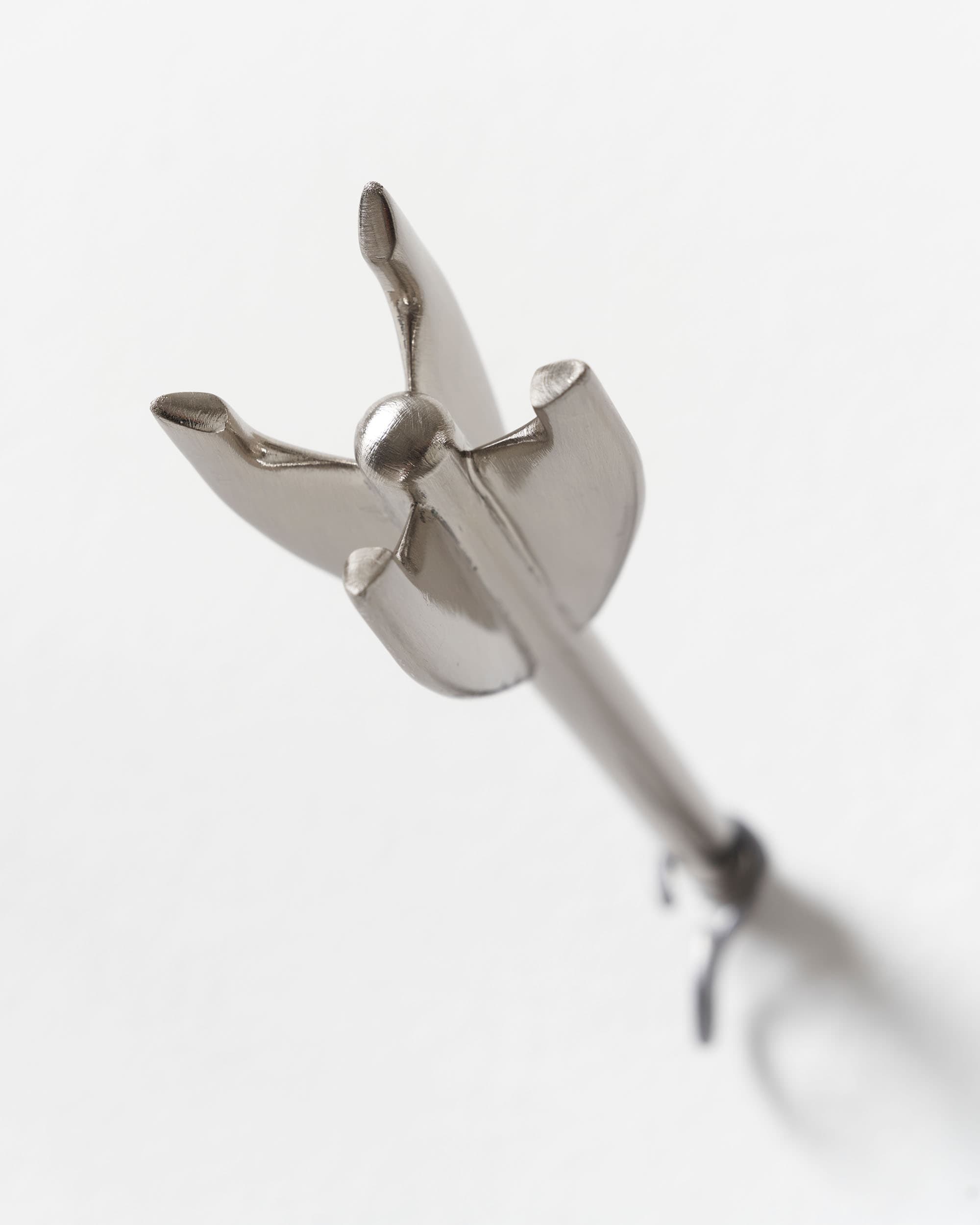 Five Brass Arrow Wall Hooks - image 6 - close-up of the tail of one of the hooks