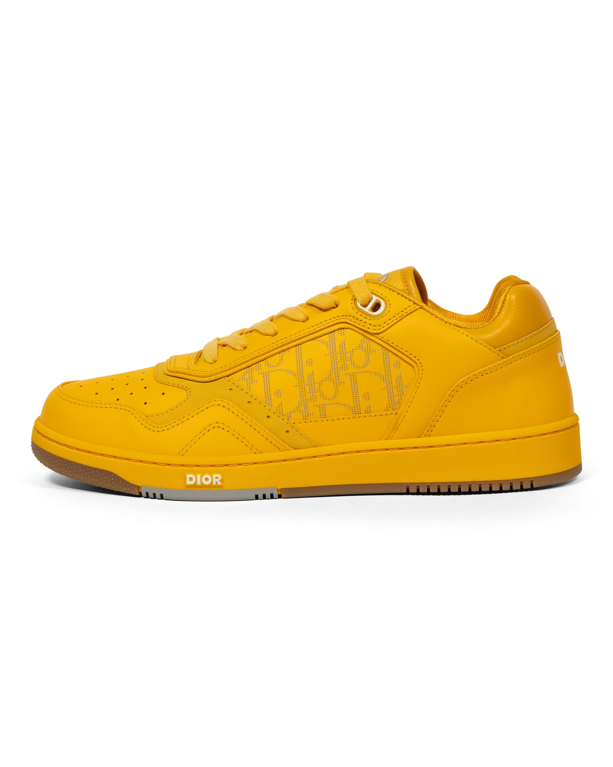 B27 Low Oblique World Tour Yellow Sneakers - image 1 - side view of one sneaker showing the Dior Oblique logo